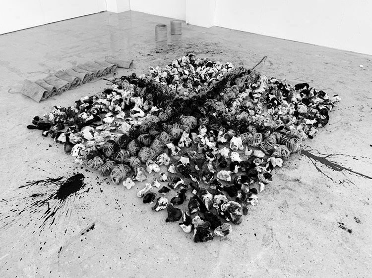 CHTHONIC no.1 - 2019  Material: Remains of 500 bones, 50l of black and white latex, 2x 68cm glass cylinders, 1km twine, 10 hessian sackcloths, ash.