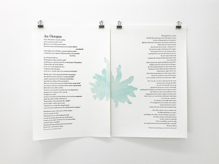 View of a two-part work on paper hanging on the wall. A poem and an abstract, octopus-like figure are printed in ink on paper.