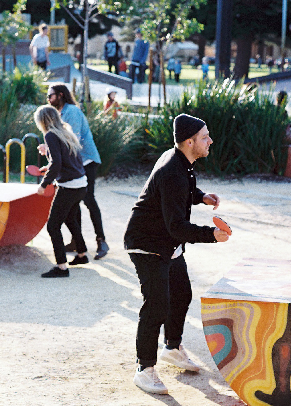 people playing outdoor table tennis on some popp tables in Fremantle, Western Australia